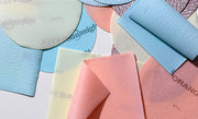 Flexible abrasive film discs and sheets ideal for sanding contoured and concave surfaces like car parts.