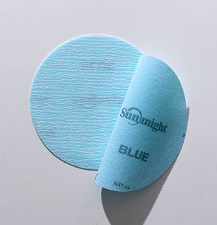 Flexible abrasive film discs and sheets demonstrating use on car hood and door frame for optimal contour sanding.