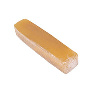 Person using a belt eraser to clean a sanding belt, effectively removing debris and extending its life.